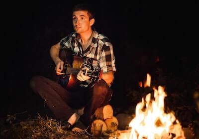 campfire guitarist
